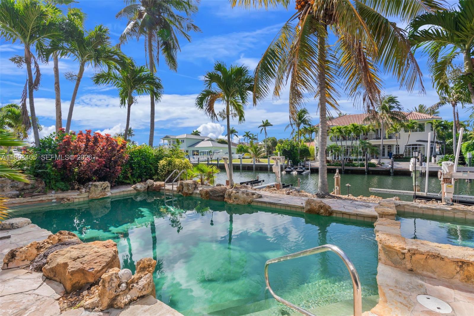 2858 Northeast 33rd Street Lighthouse Point, FL 33064 - Photo 7 of 24 a view of swimming pool with a table and chairs