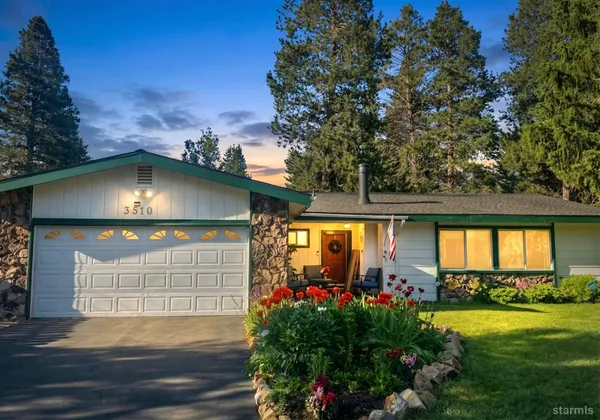 a front view of house with outdoor space and swimming pool