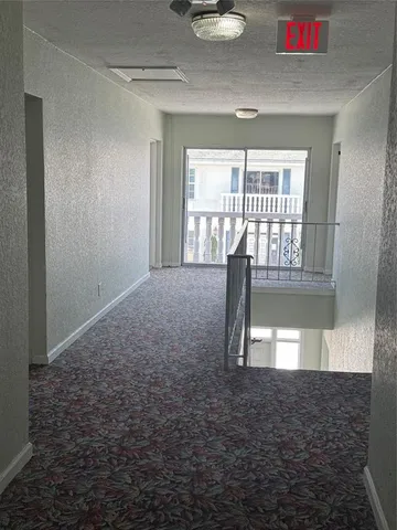 a view of empty room with floor to ceiling window