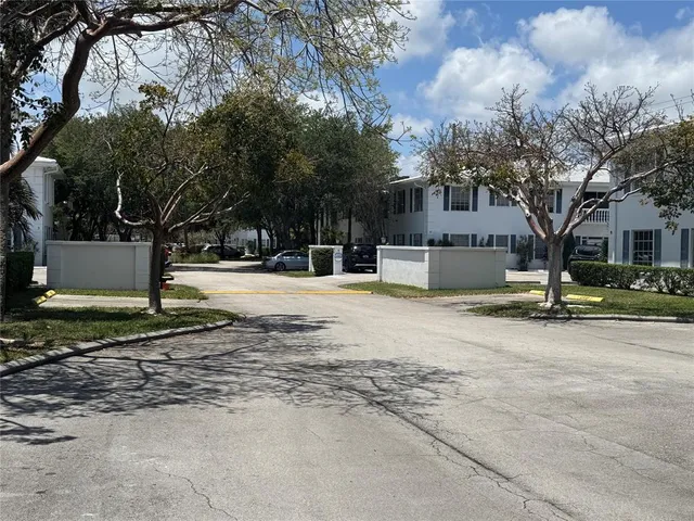 a view of street with large trees