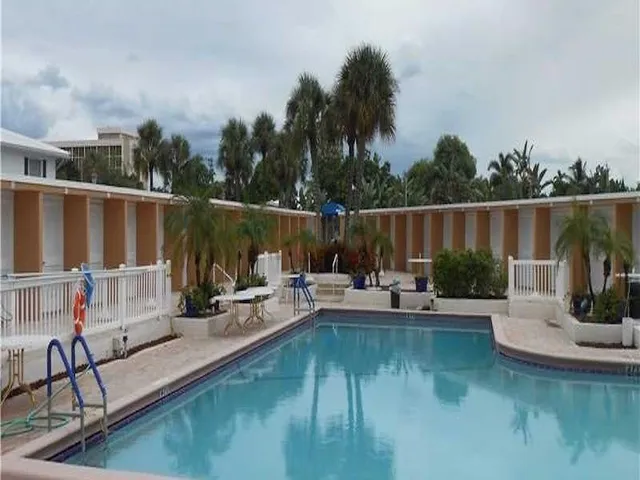 a view of a swimming pool with chairs