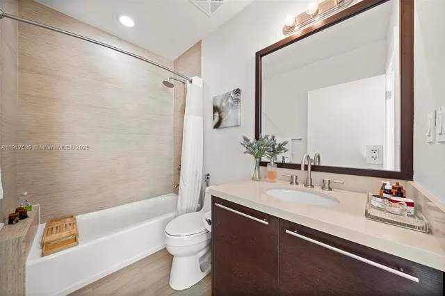 a bathroom with a sink a toilet and a bathtub