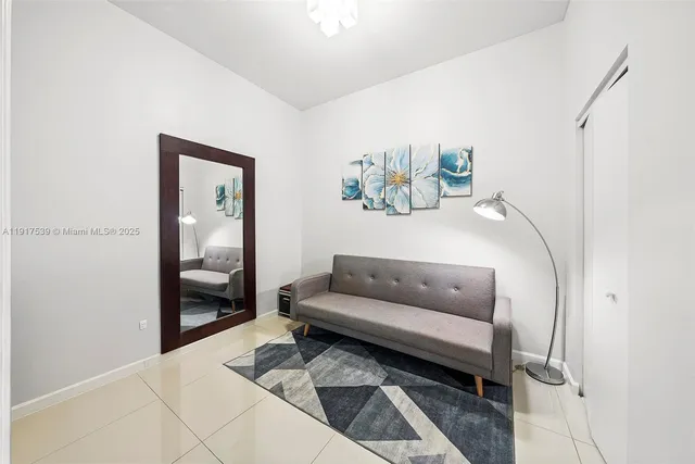 a living room with furniture and a rug