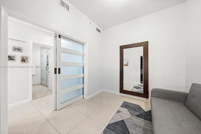 a view of a livingroom with a furniture and closet