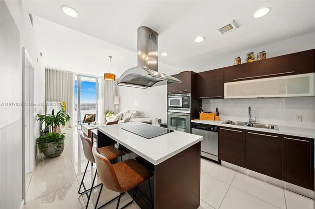 a kitchen with a table and chairs in it