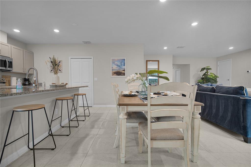 418 Fleming Street Sebastian, FL 32958 - Photo 7 of 38 a kitchen with a table and chairs in it
