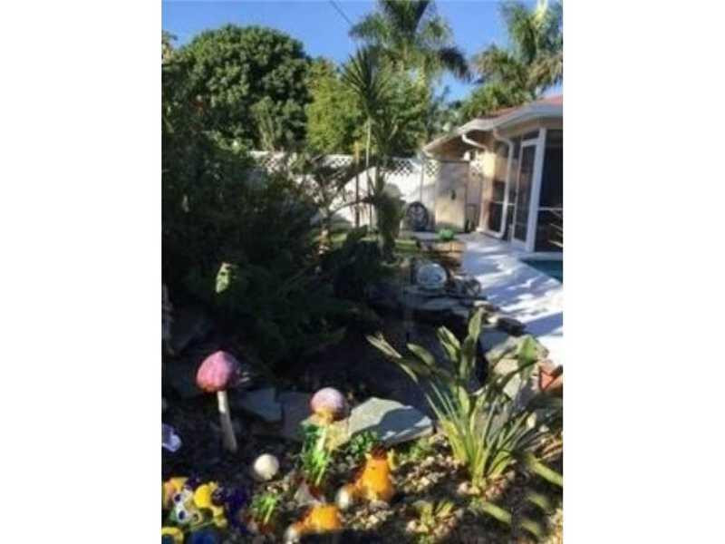 127 Winged Foot Lane Boca Raton, FL 33431 - Photo 3 of 6 a backyard of a house with lots of green space