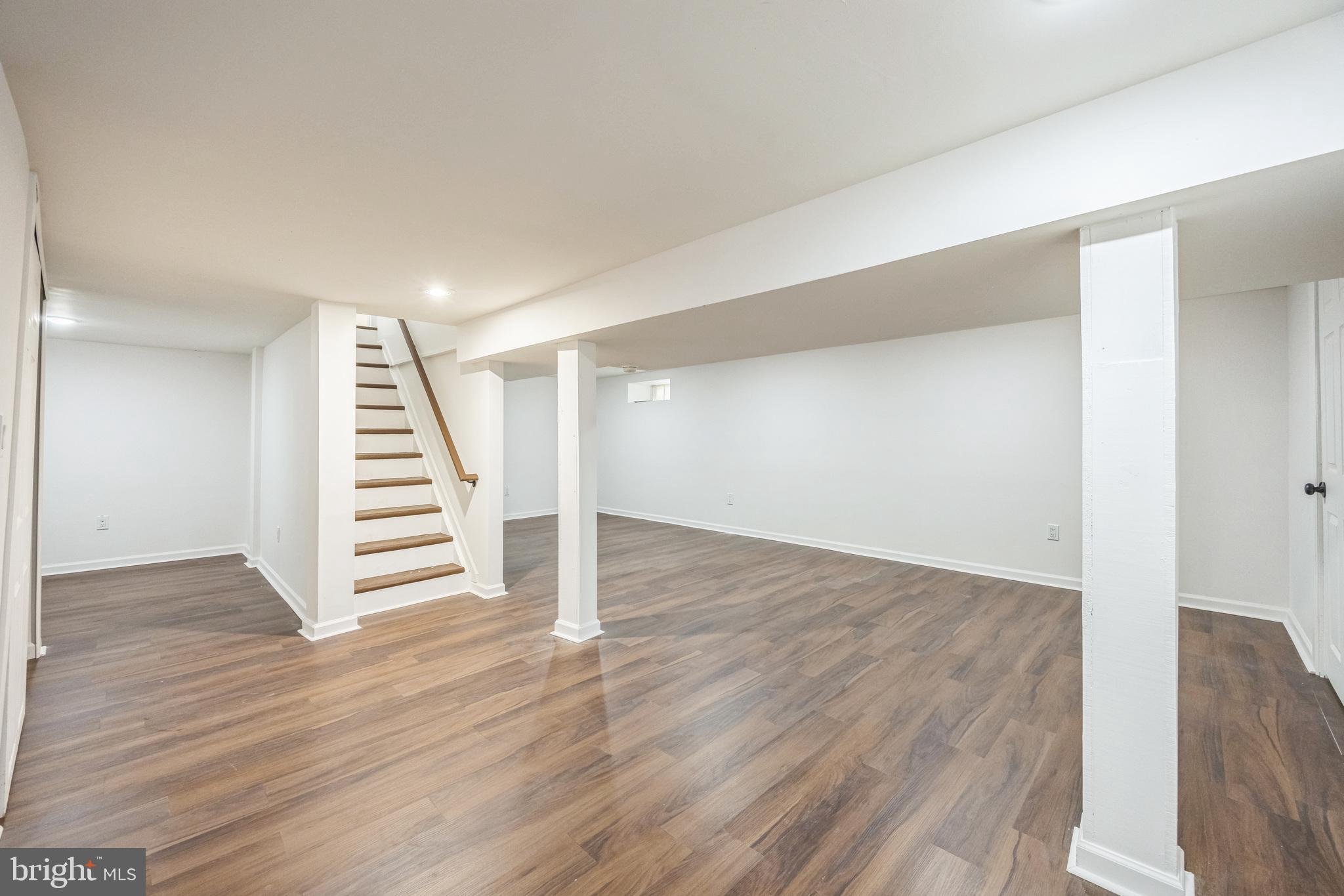 76 Edison Road Cherry Hill, NJ 08034 - Photo 24 of 29 an empty room with wooden floor and stairs