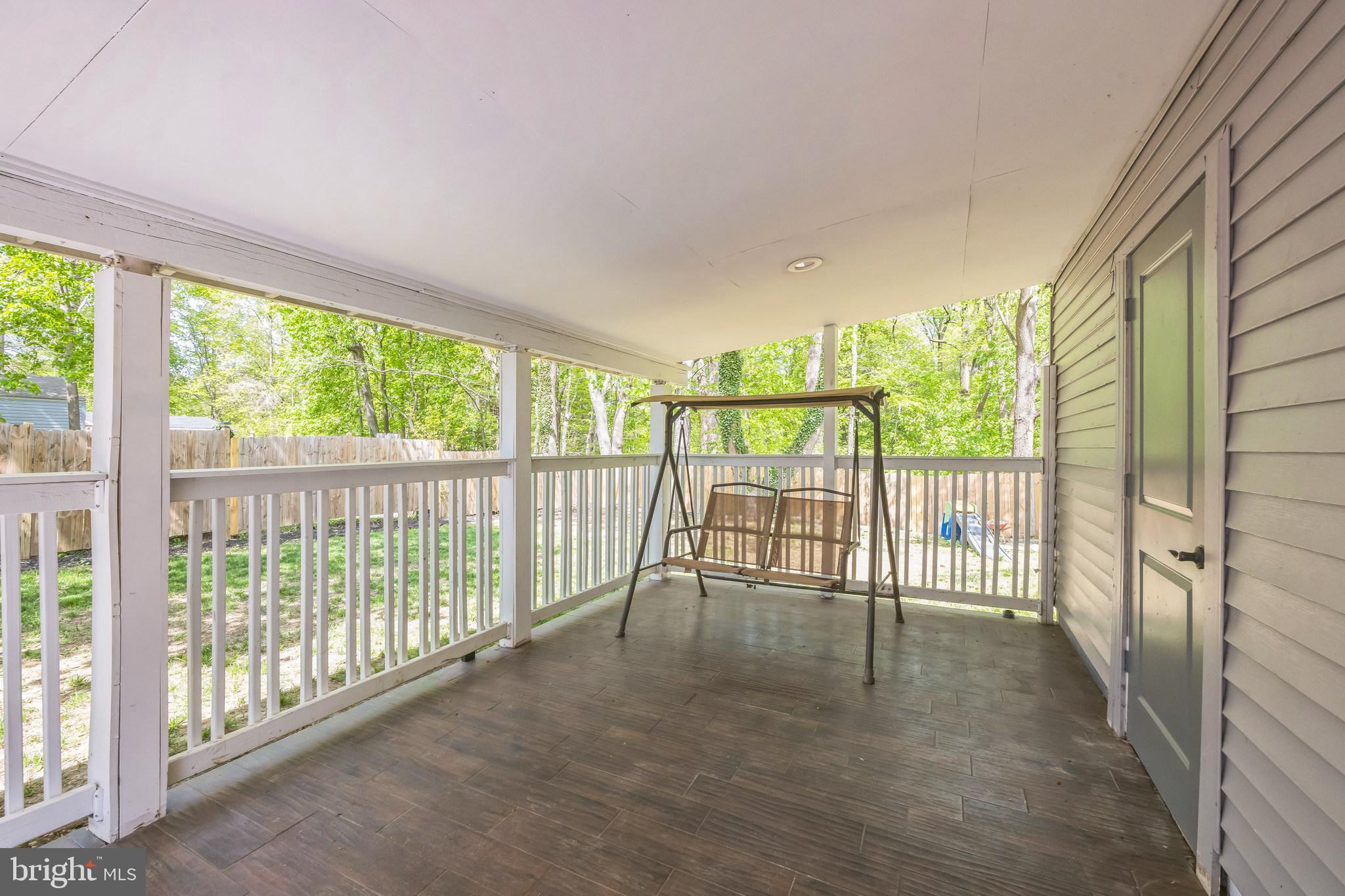 76 Edison Road Cherry Hill, NJ 08034 - Photo 3 of 29 a view of a porch with wooden floor and outdoor space