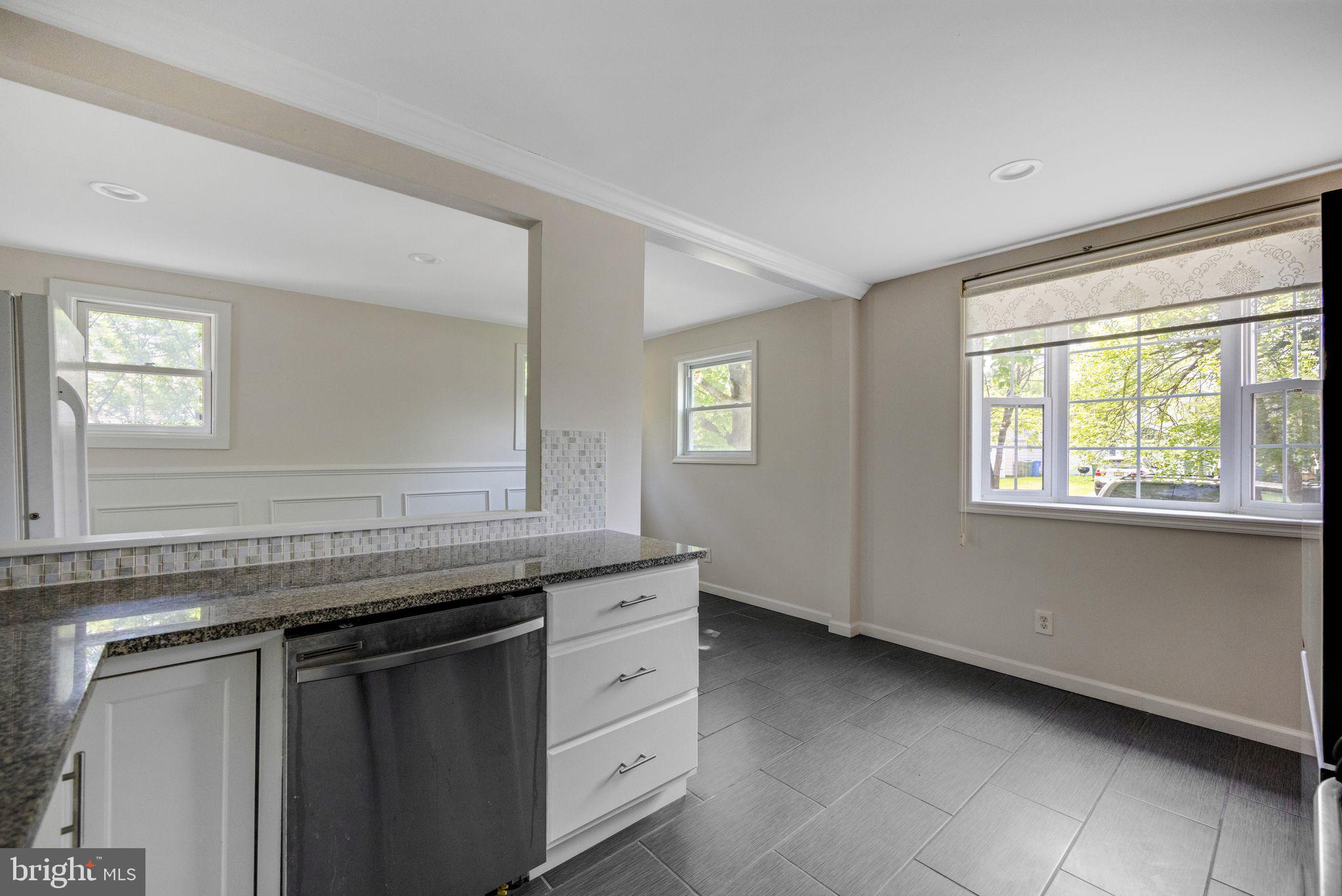 76 Edison Road Cherry Hill, NJ 08034 - Photo 8 of 29 a kitchen with granite countertop a sink and a window