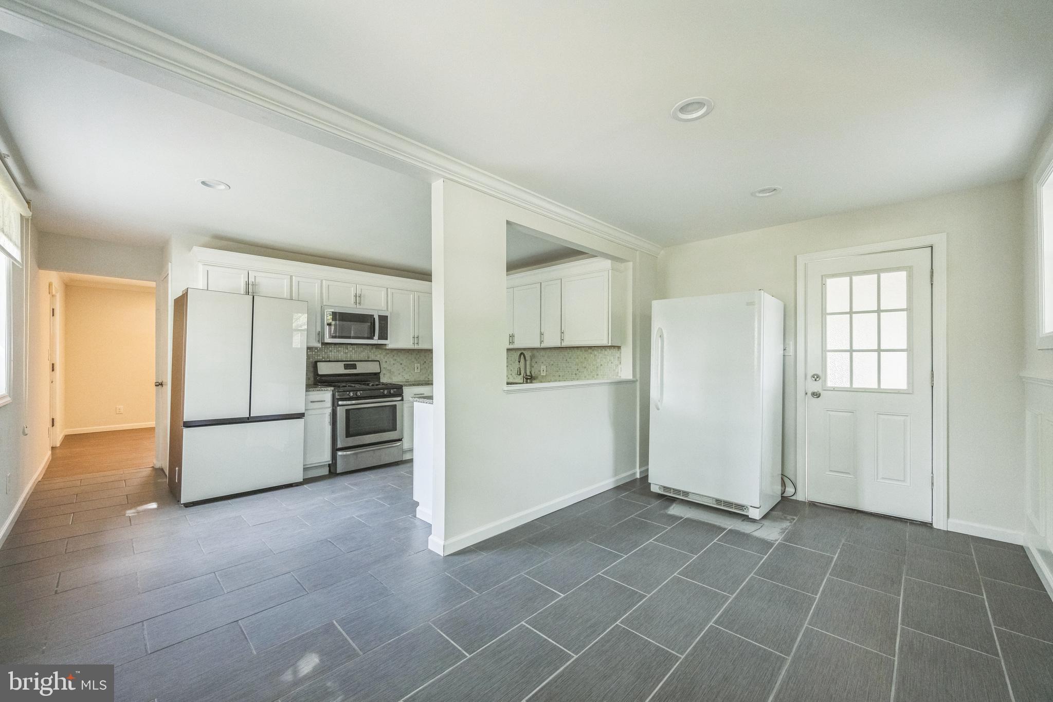 76 Edison Road Cherry Hill, NJ 08034 - Photo 9 of 29 a view of a kitchen with a sink refrigerator and cabinets