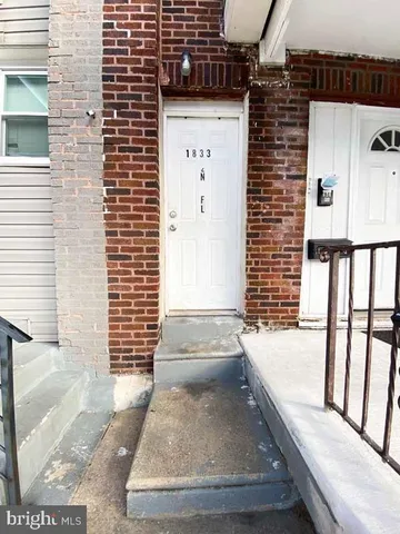 a view of staircase with open kitchen