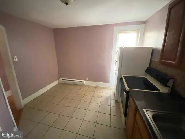 a room with washing machine and window