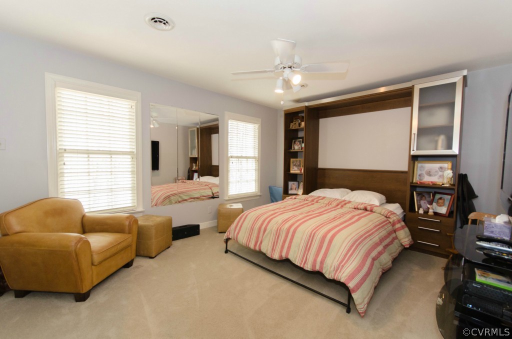 2209 Kings Lynn Road Midlothian, VA 23113 - Photo 17 of 24 a bedroom with a bed couch and window