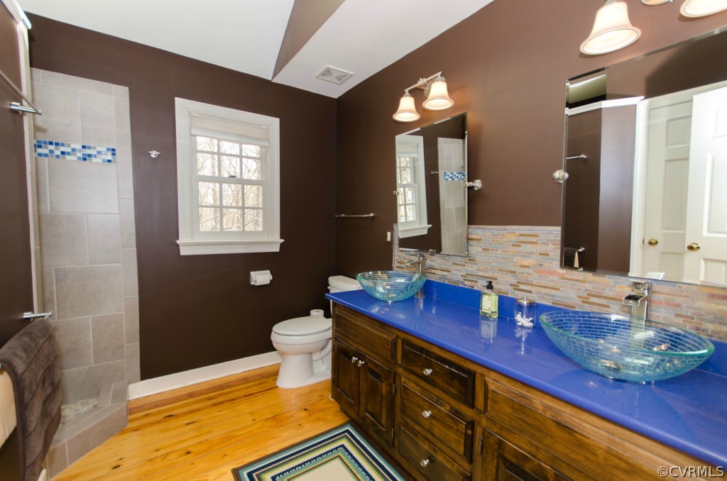 2209 Kings Lynn Road Midlothian, VA 23113 - Photo 20 of 24 a bathroom with a sink a toilet and mirror