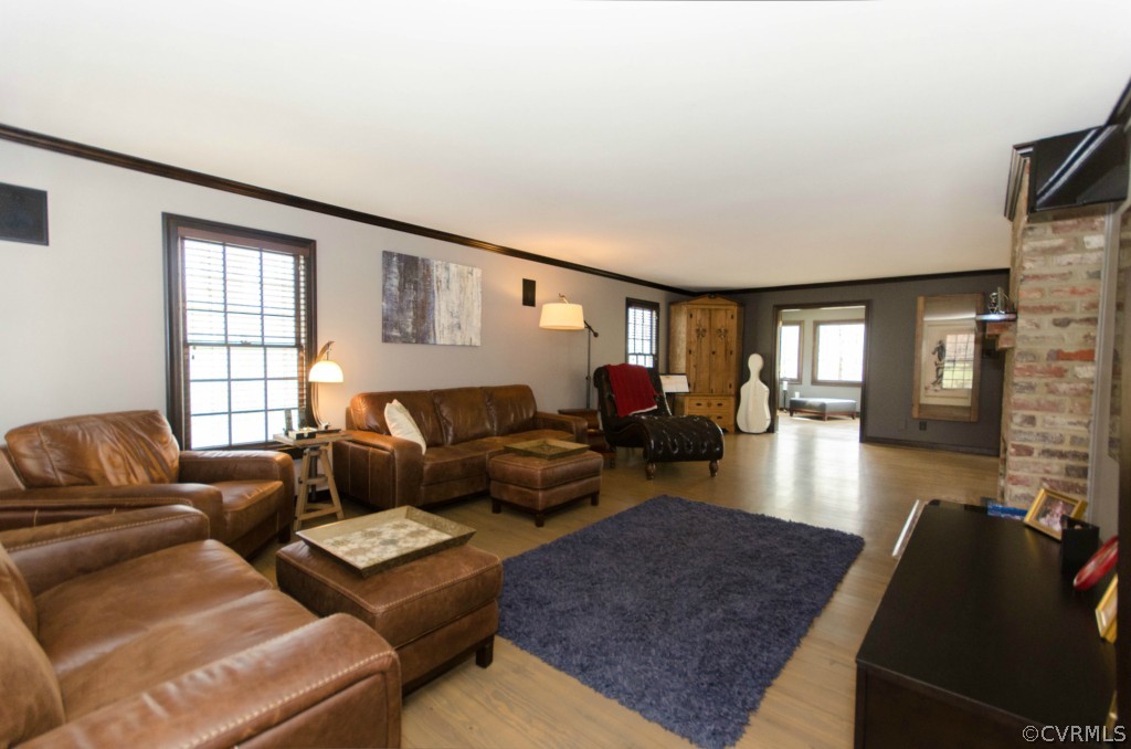 2209 Kings Lynn Road Midlothian, VA 23113 - Photo 8 of 24 a living room with furniture fireplace and a large window