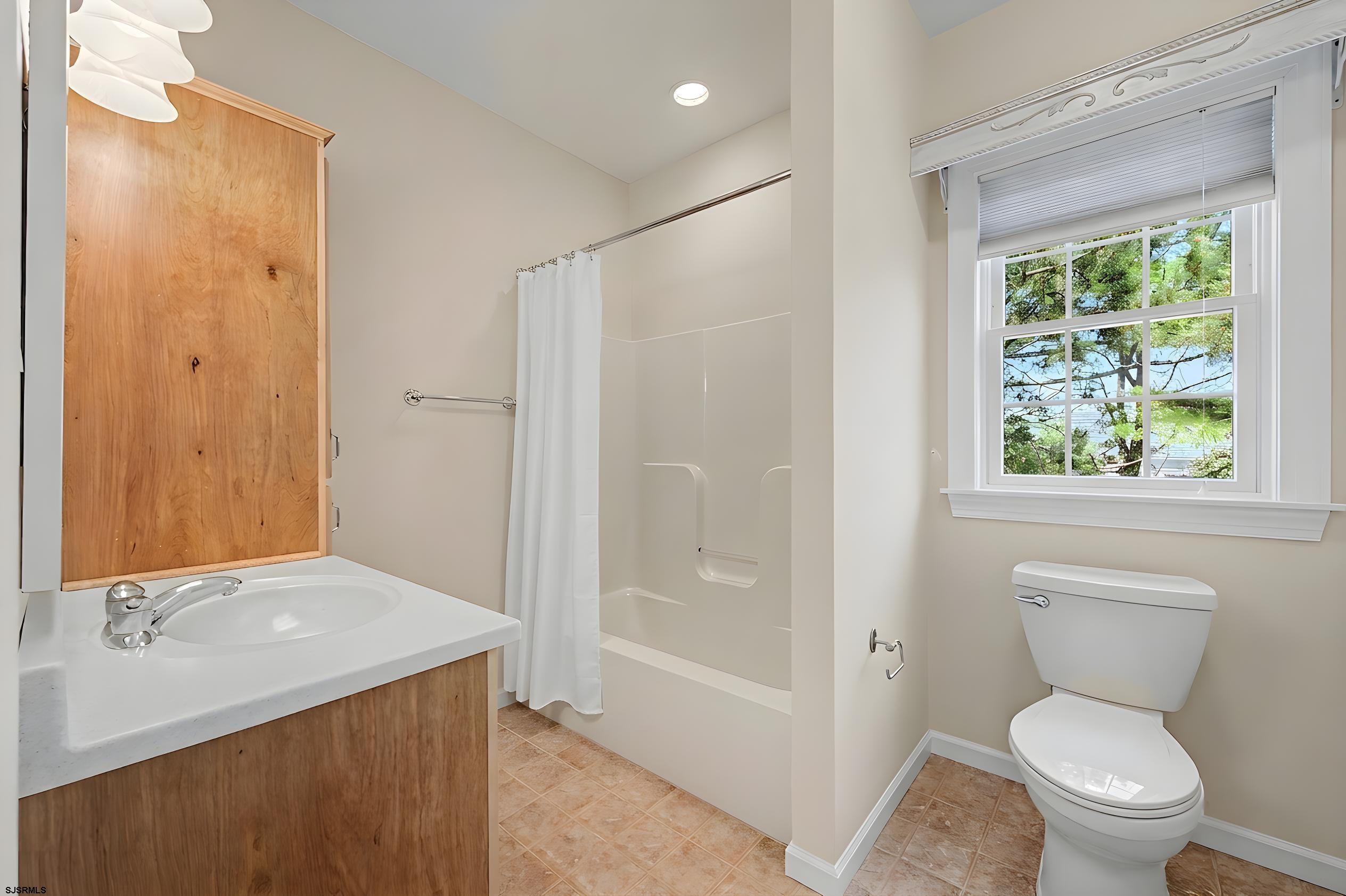 212 17th Street South Brigantine, NJ 08203 - Photo 26 of 37 a bathroom with a granite countertop sink toilet and shower