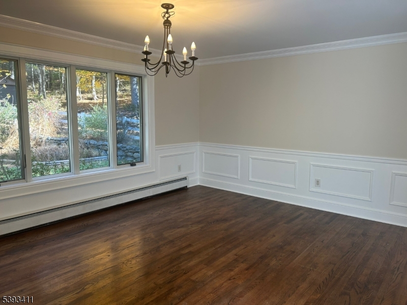 102 Drakestown Road Hackettstown, NJ 07840 - Photo 12 of 28 a view of an empty room with wooden floor and a window