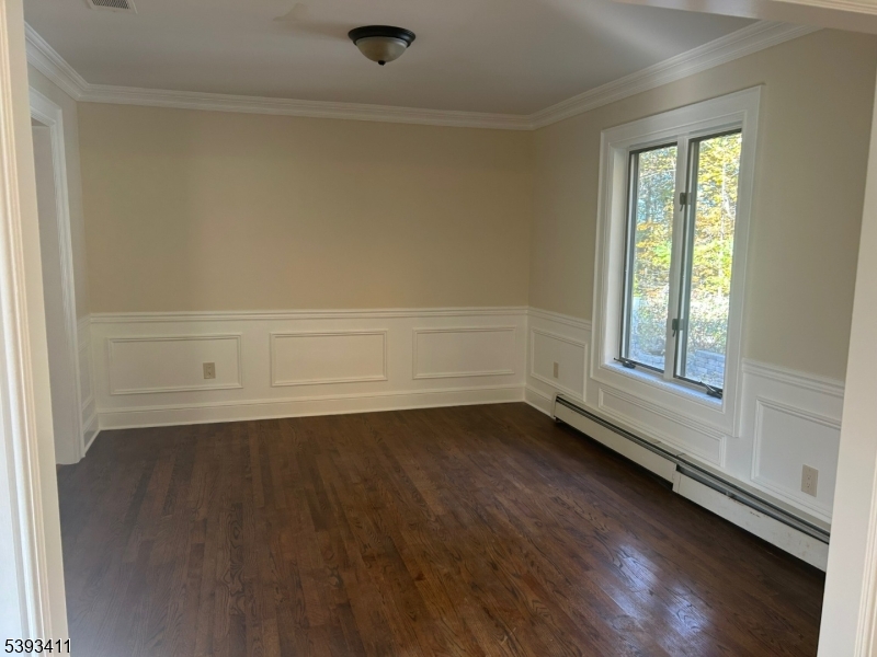 102 Drakestown Road Hackettstown, NJ 07840 - Photo 13 of 28 a view of an empty room with wooden floor and a window