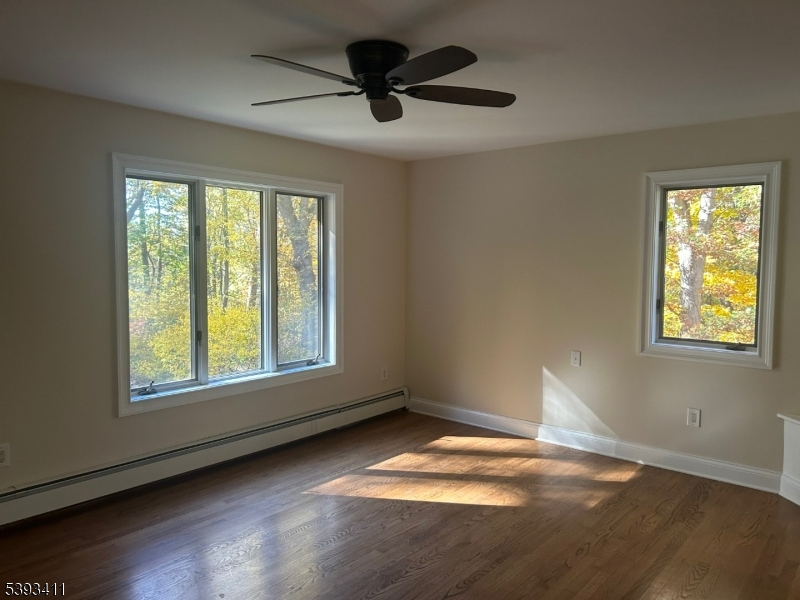 102 Drakestown Road Hackettstown, NJ 07840 - Photo 15 of 28 a view of an empty room with wooden floor and a window