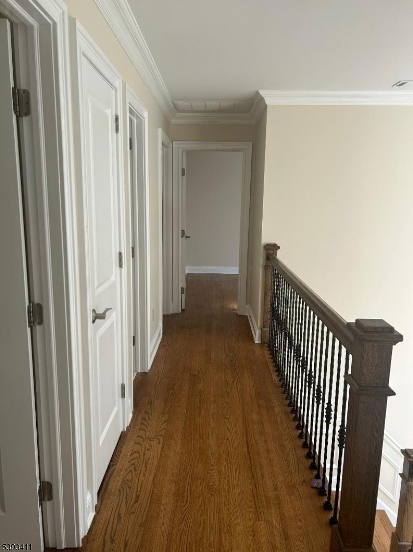 102 Drakestown Road Hackettstown, NJ 07840 - Photo 17 of 28 a view of a hallway with wooden floor and staircase