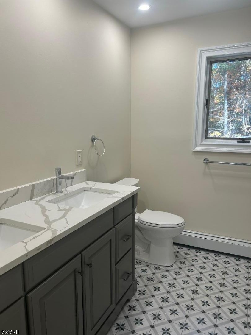 102 Drakestown Road Hackettstown, NJ 07840 - Photo 19 of 28 a bathroom with a granite countertop sink a toilet and a mirror