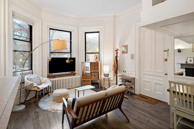 a living room with furniture fireplace and a flat screen tv