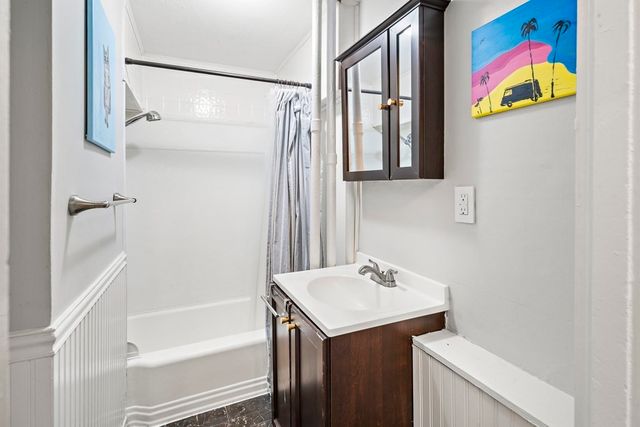 a bathroom with a sink and a bathtub
