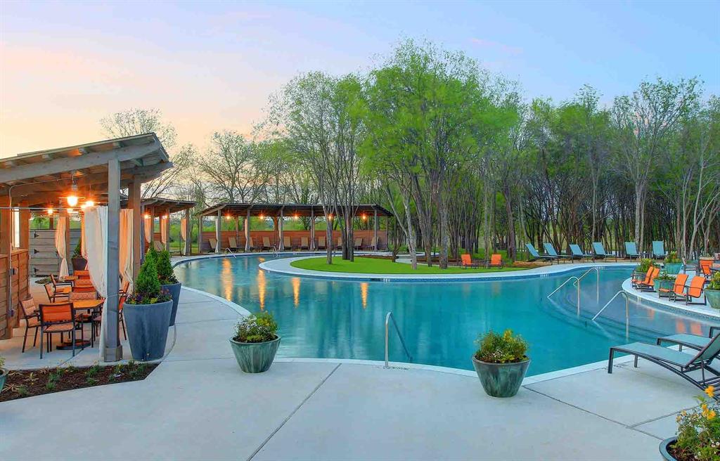 537 Oakmoss Street Little Elm, TX 76227 - Photo 36 of 39 a view of fountain along the path and a garden
