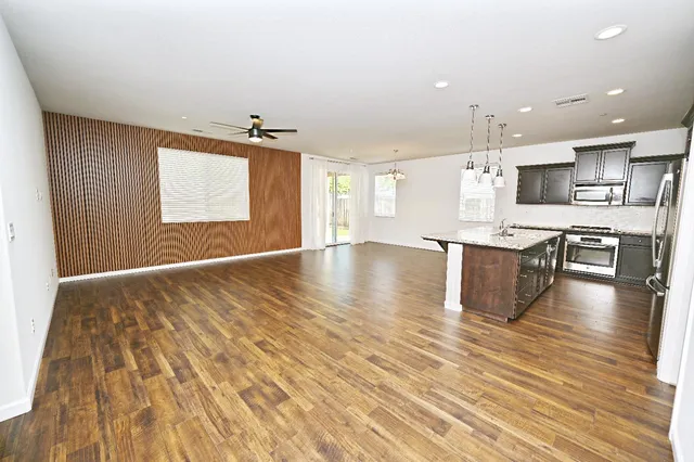 a view of kitchen with cabinets