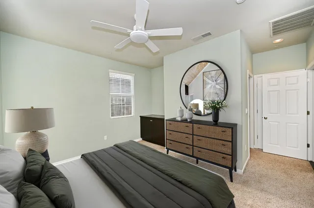 a bed room with a bed and a chandelier