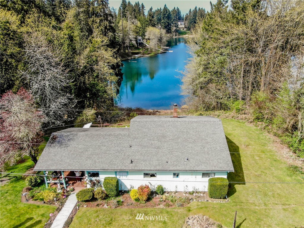 an aerial view of a house with yard