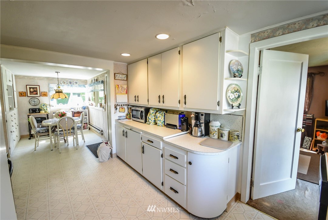 5425 Blvd Ext Road Southeast Olympia, WA 98501 - Photo 11 of 29 a large white kitchen with a large window