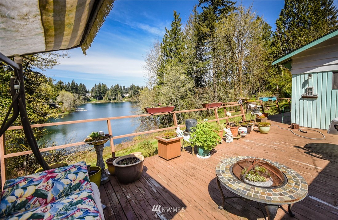 5425 Blvd Ext Road Southeast Olympia, WA 98501 - Photo 16 of 29 a view of a balcony with chair and potted plants
