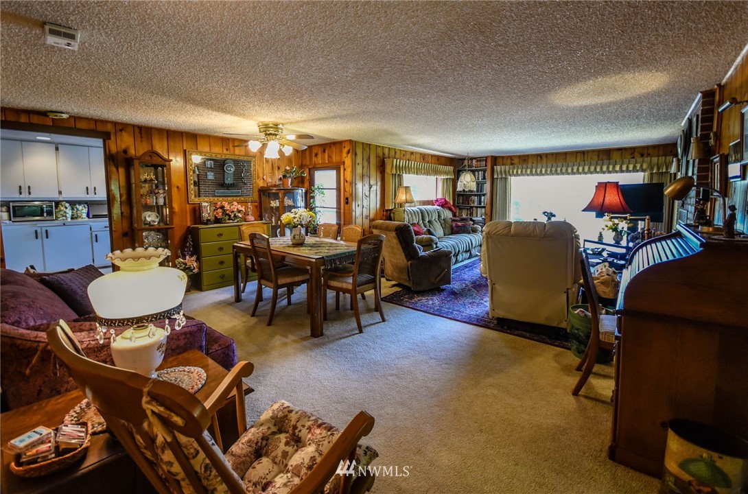 5425 Blvd Ext Road Southeast Olympia, WA 98501 - Photo 22 of 29 a living room with furniture and a dining table