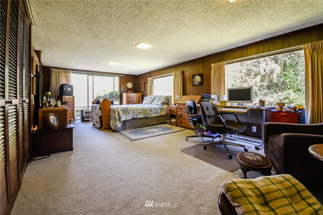5425 Blvd Ext Road Southeast Olympia, WA 98501 - Photo 26 of 29 a living room with furniture flat screen tv and a large window