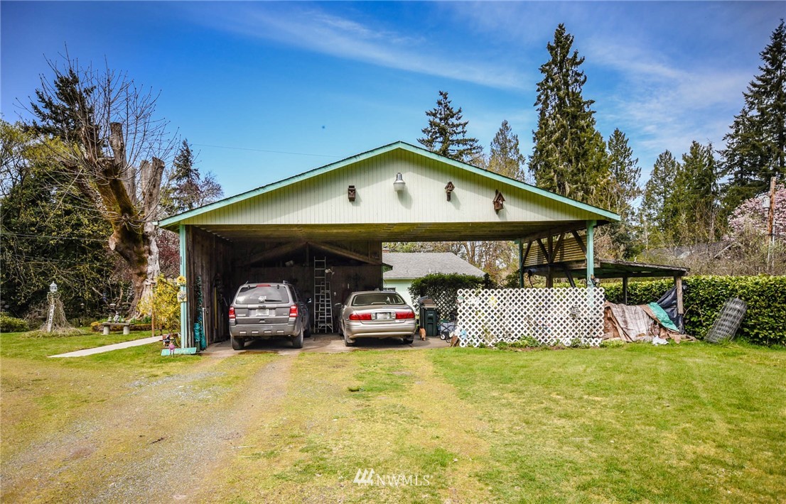 5425 Blvd Ext Road Southeast Olympia, WA 98501 - Photo 5 of 29 a front view of a house with garden