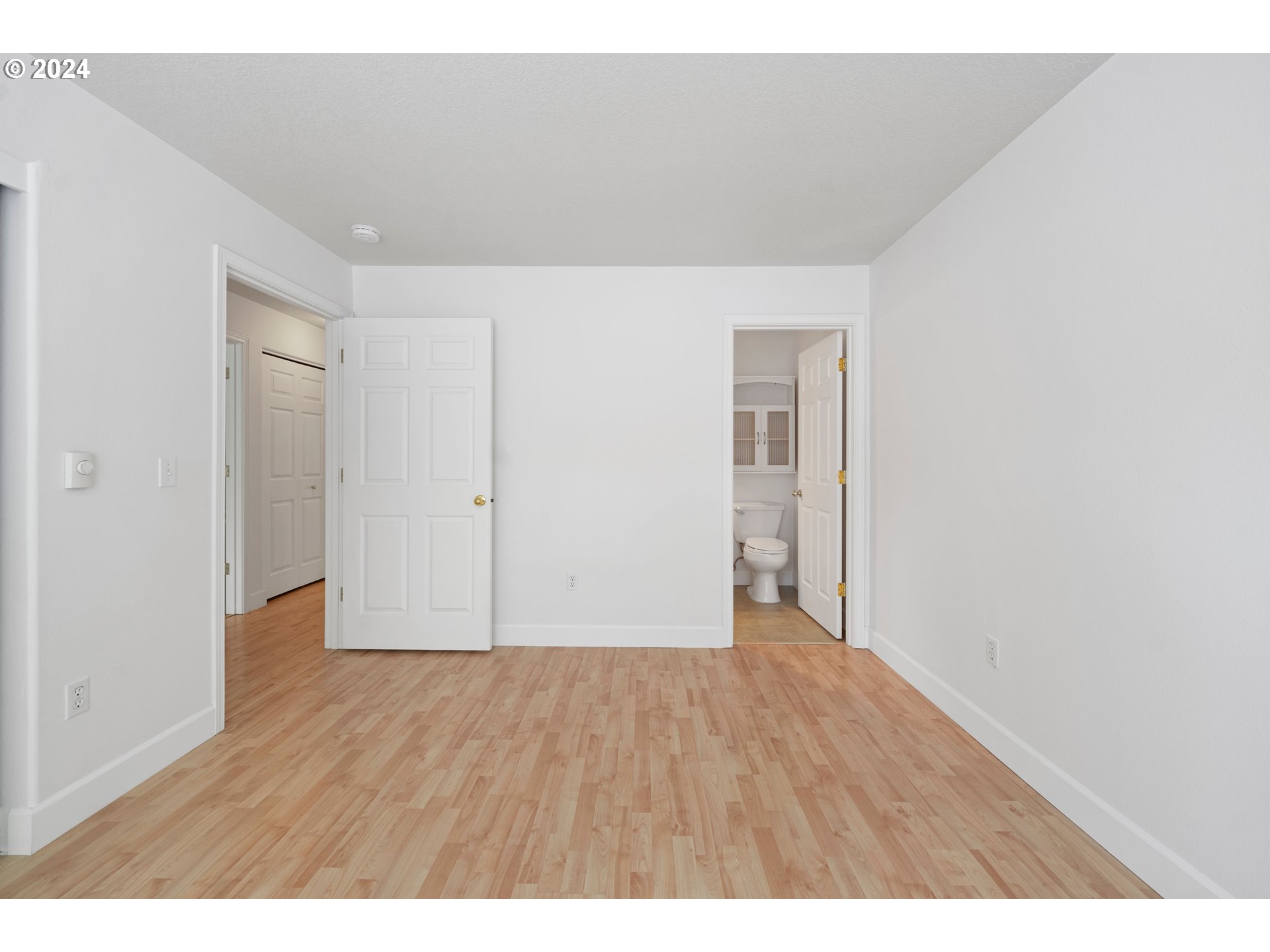 4744 West Powell Boulevard, Unit 127 Gresham, OR 97030 - Photo 24 of 37 a view of an empty room with wooden floor