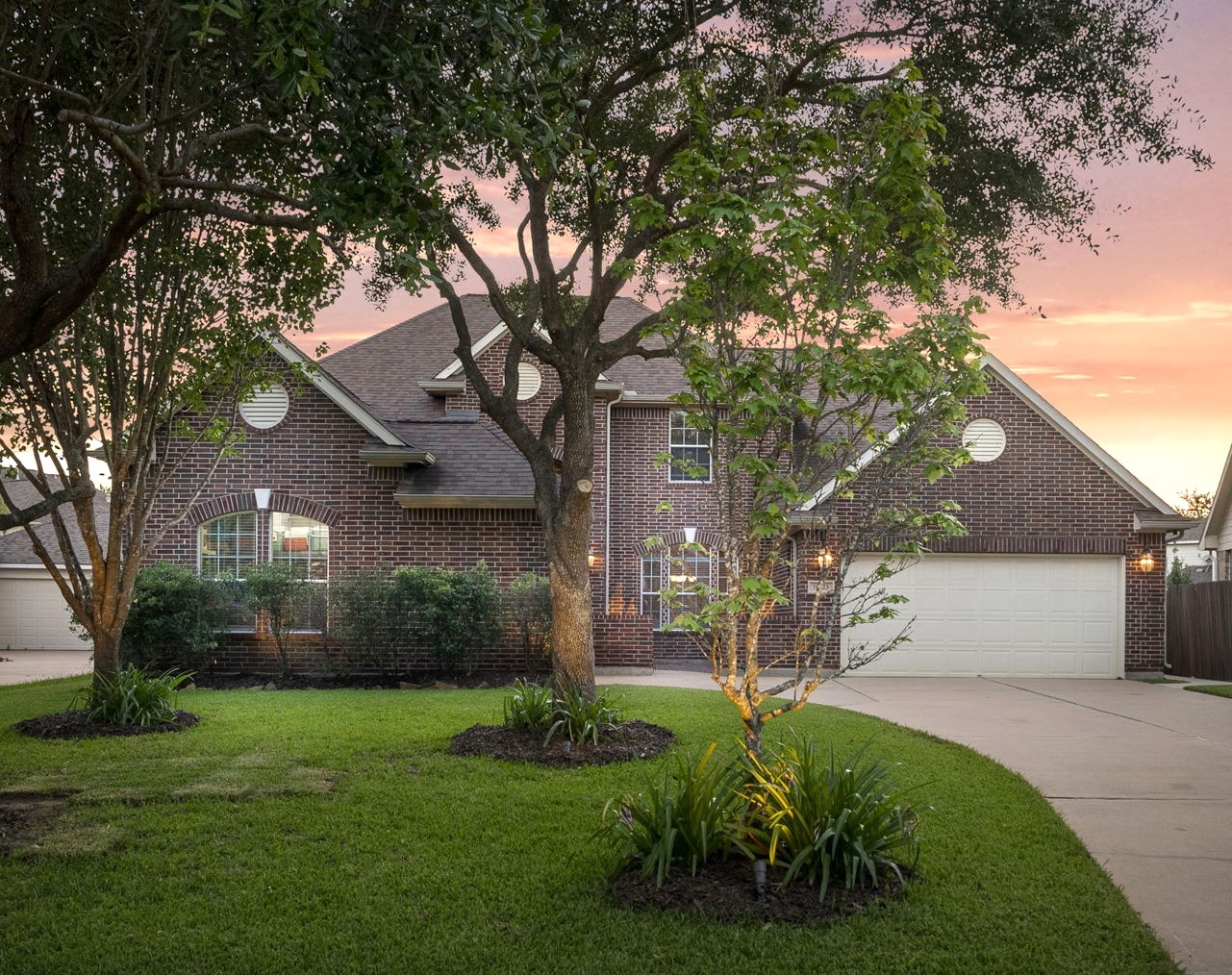 19223 Senterra Lakes Boulevard Spring, TX 77379 - Photo 4 of 48 a view of a white house next to a yard with a large tree