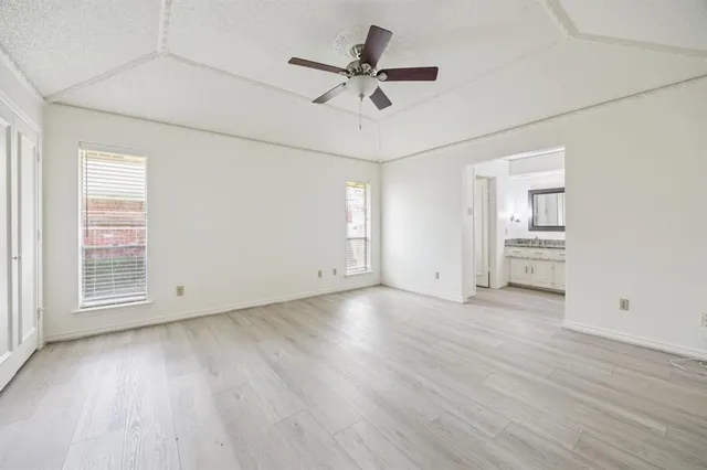 a bathroom with a granite countertop sink vanity and mirror
