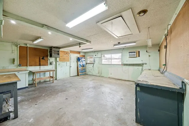 a view of a bathroom with sink shower and mirror