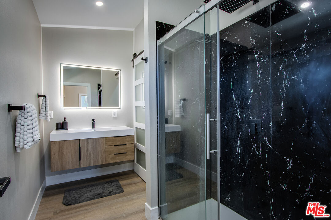 60777 Adele Road Landers, CA 92285 - Photo 18 of 43 a bathroom with a shower and a sink