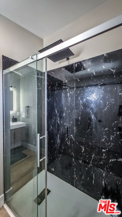 60777 Adele Road Landers, CA 92285 - Photo 19 of 43 a bathroom with a glass shower door
