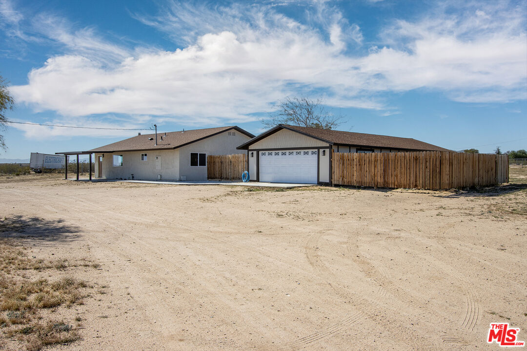 60777 Adele Road Landers, CA 92285 - Photo 25 of 43 a view of a house with a snow in the yard