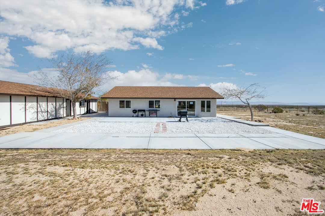 60777 Adele Road Landers, CA 92285 - Photo 29 of 43 a front view of a house with a yard