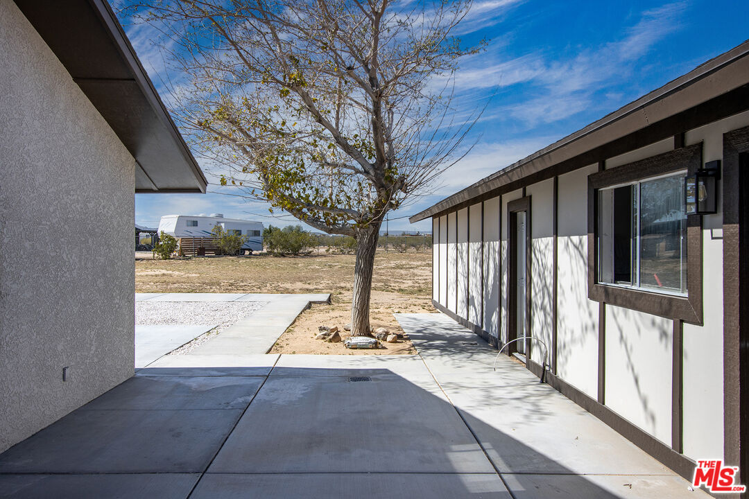 60777 Adele Road Landers, CA 92285 - Photo 32 of 43 a view of a house with wooden fence