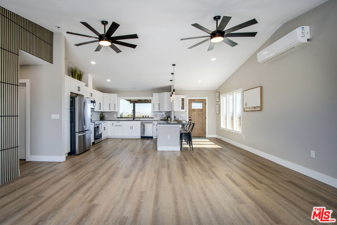 60777 Adele Road Landers, CA 92285 - Photo 8 of 43 a living room with stainless steel appliances furniture and a window