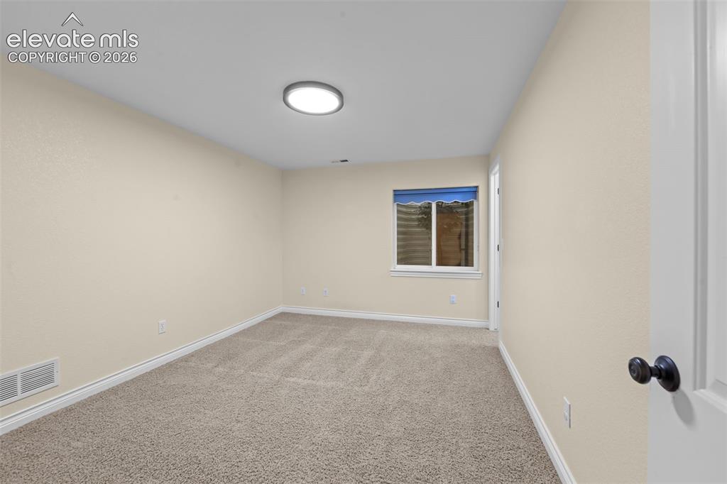 16540 Mesquite Road Peyton, CO 80831 - Photo 35 of 50 an empty room with windows