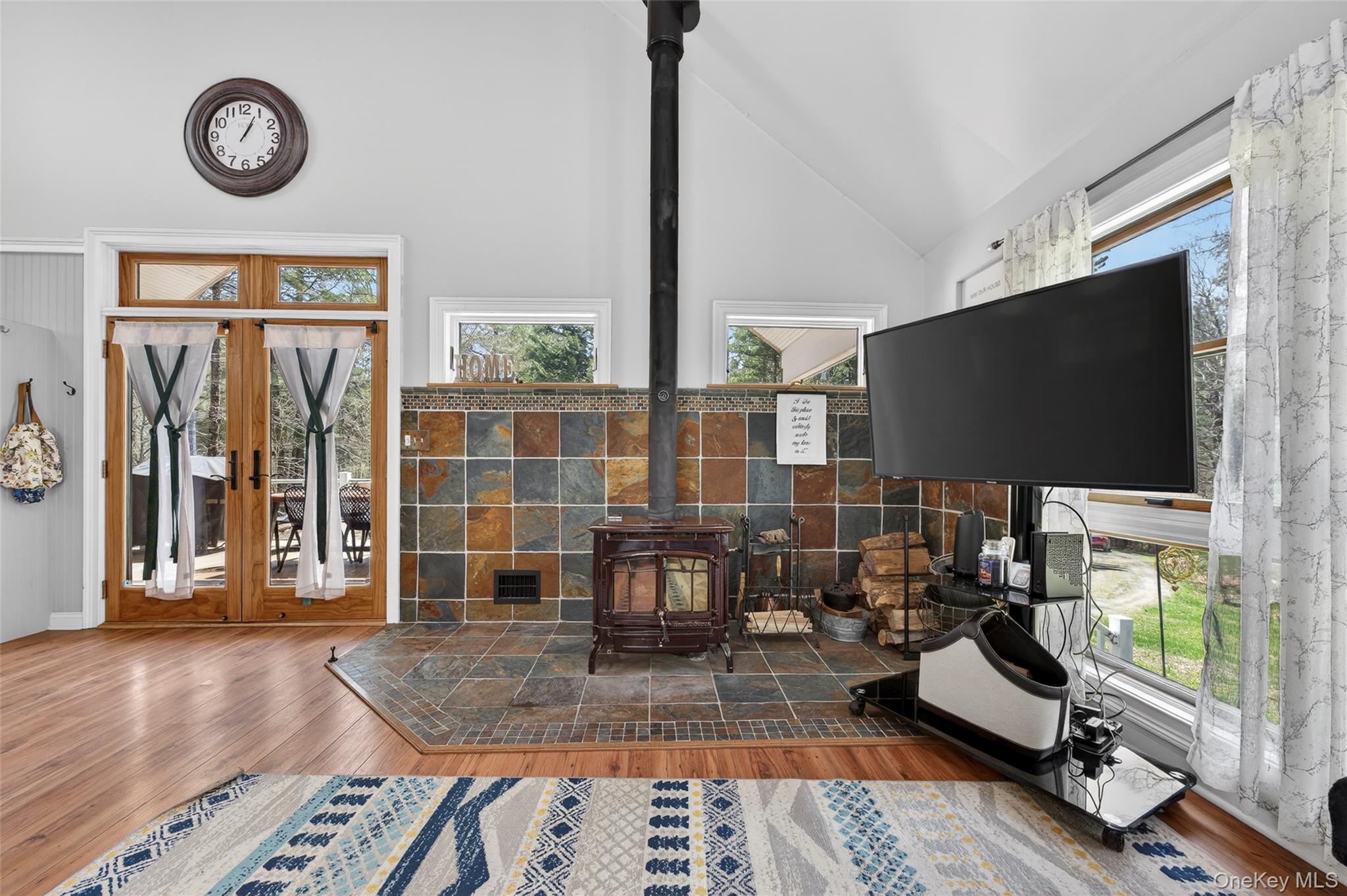 465 Schalck Road Narrowsburg, NY 12764 - Photo 11 of 31 a living room with furniture and a flat screen tv