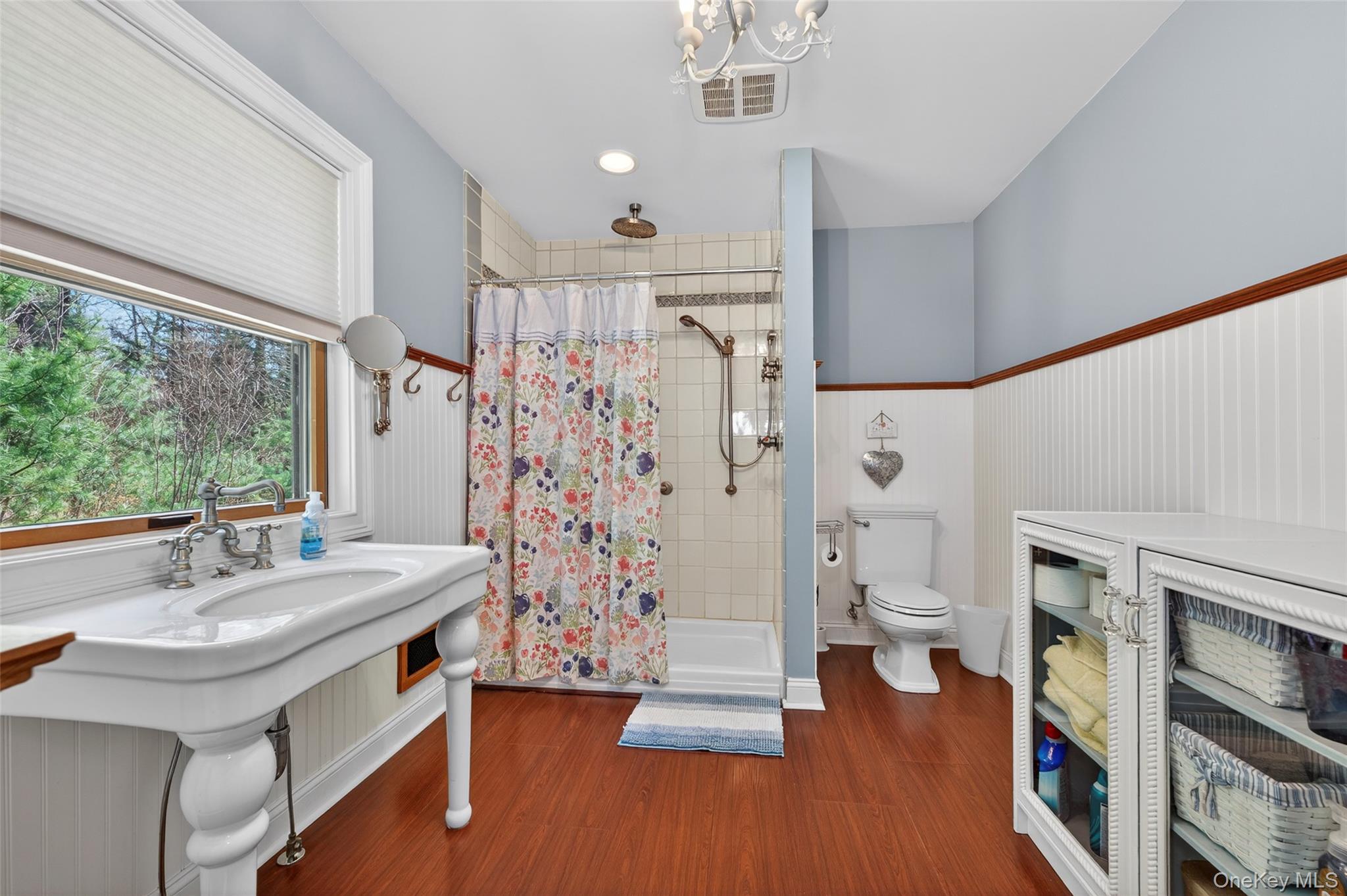 465 Schalck Road Narrowsburg, NY 12764 - Photo 17 of 31 a spacious bathroom with a shower curtain and a sink